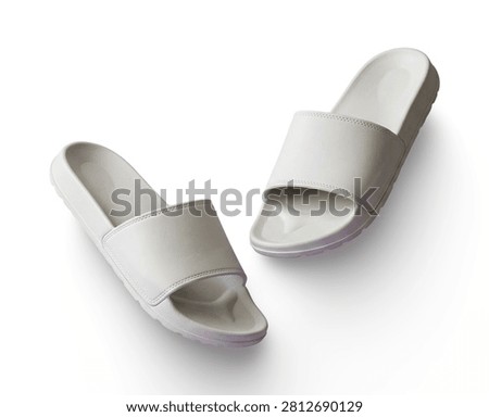 Light grey slide sandals floating on purple background