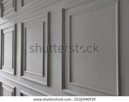 Light grey square shape wainscoting.