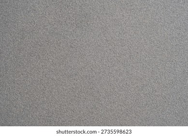 Light grey textured plastic surface background, subtle grain pattern full frame wallpaper, abstract minimal neutral backdrop with copy space, blank template for design, top view material closeup