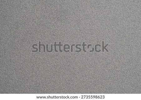 Light grey textured plastic surface background, subtle grain pattern full frame wallpaper, abstract minimal neutral backdrop with copy space, blank template for design, top view material closeup