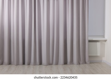 Light grey window curtains in living room - Shutterstock ID 2234620435