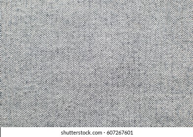 Light grey woolen or tweed fabric for grunge background