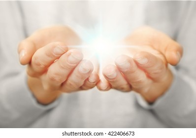 Light In Hands.  Concept Of Taking, Care, Protection