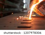 Light from high temperature Iron molten metal pouring in green sand mold ;Foundry process to manufacture cast product for automotive and electrical; industrial engineering metallurgy background , 