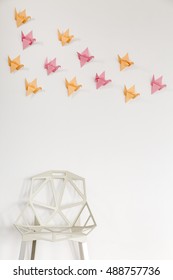 Light Home Interior With Modern Crystal Chair And Origami Wall Decor