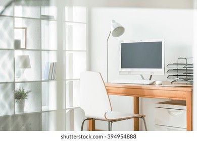 Light Home Office With Simple Chair And Wood Desk, Standing Lamp And Computer