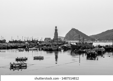 Light house in Dalian old harbor Dalian, China, Chinese Lighthouse in harbour. black and with vintage picture Light house in Dalian old harbor Dalian, China, Chinese Lighthouse in harbour. black