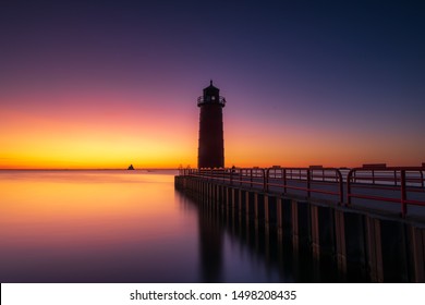 Light House On Lake Michigan In Milwaukee, Wisconsin At Sunrise