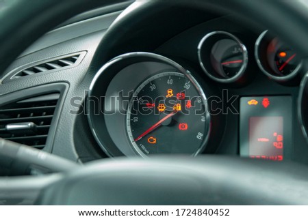 Light icons for checking the correct operation of car systems are lit on the front panel.