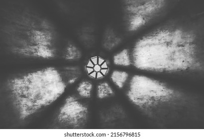 light from the lamp on the ceiling and the shadows in the mysterious corridor in the old dungeon of the castle, black and white - Shutterstock ID 2156796815
