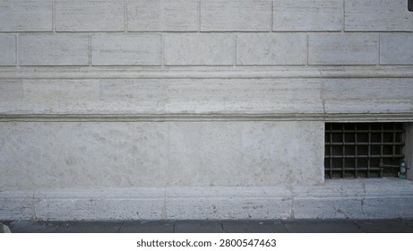 Light limestone facade wall texture with sharp detail, outdoor building frontage; background backplate copyspace template.