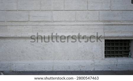 Light limestone facade wall texture with sharp detail, outdoor building frontage; background backplate copyspace template.