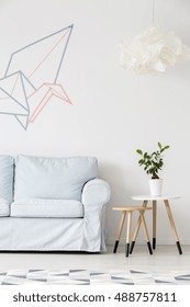 Light Living Room With Sofa, Pattern Carpet, Side Table And Washi Tape Wall Decor