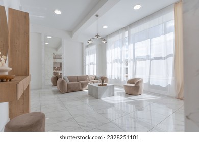 light luxury interior design of a modern apartment in a minimalist style with marble trim and huge windows. daylight inside the kitchen and living room - Powered by Shutterstock