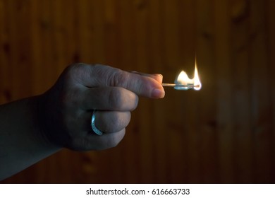 To Light A Match. The Woman Lights A Match, Fire From A Match.