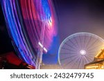 Light motion of ferris wheel at night