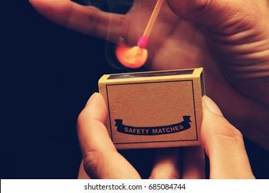 Light My Fire - Someone Holding A Matchbox While Striking A Match