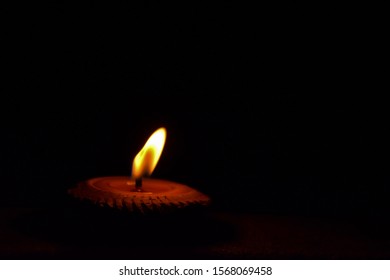 The light of the night candles in the light brown rice lamp used on holy days, important religious days and traditions, showing the spirit of Thai people in the north - Powered by Shutterstock