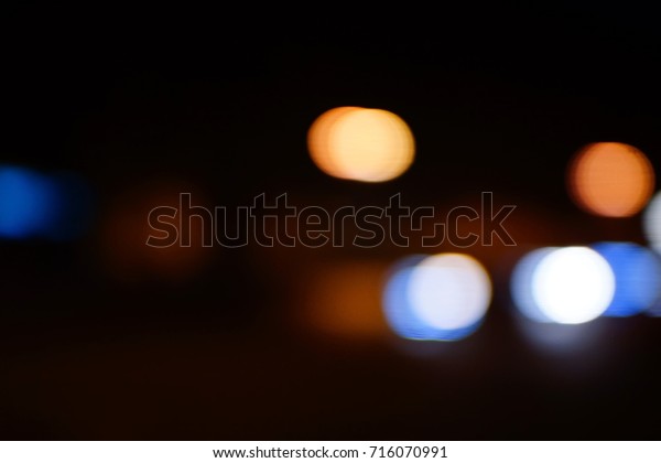 Light night at city blue bokeh abstract
background blur lens flare reflection beautiful circle glitter lamp
street with dark sky festival
firework