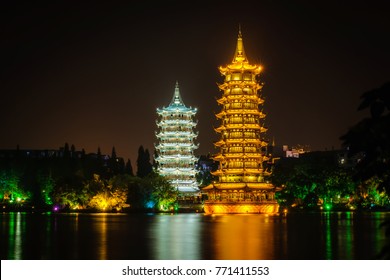 Light up in night time at Guilin's Sun and Moon Twin Pagodas (one of the Guilin's attractions) in Shanhu (Shan Lake), Guangxi, Guilin China. - Powered by Shutterstock