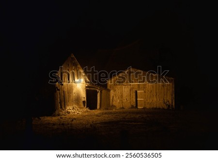 The light of an old barn on a cold autumn night near Dunrobin, Ontario, Canada