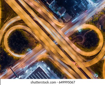 The light on the road roundabout at night and the city in Bangkok, Thailand. Aerial view. Top view. Background scenic road.