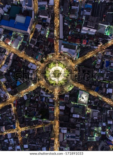 The light on the road  roundabout at night and the city in Bangkok, Thailand.Aerial view.Top view.Light scenic road.