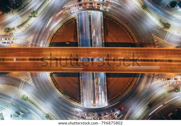 The light on the road roundabout
at night and the city in Bangkok, Road beautiful Aerial View of
Busy Intersection, Aerial view. Top view. Background scenic
road.