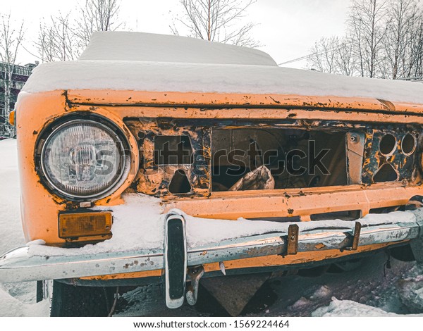 Light\
orange car. Soviet car covered in rust.\
Rarity