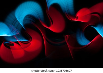 Light painting abstract background. Blue and red light painting photography, long exposure, ripples and swirl against a black background. - Powered by Shutterstock