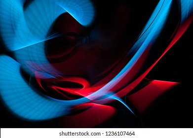 Light painting abstract background. Blue and red light painting photography, long exposure, ripples and swirl against a black background. - Powered by Shutterstock