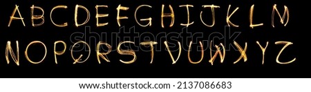 Light painting alphabet A B C D E F Z on black back ground , Orange letters A B C D F Z, Kid funny painting alphabet  for creative decoration art pattern abstract