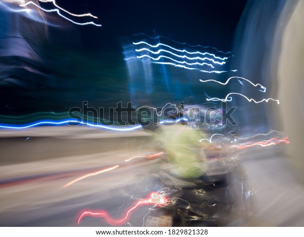 Light painting created through various light sources 
residents vehicles headlight to brake light and street lamp and
police light and  historical place lighting colorful vehicle 
ambulance crane 