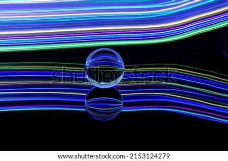 Light painting with cristal ball and blue, red and purple colors
