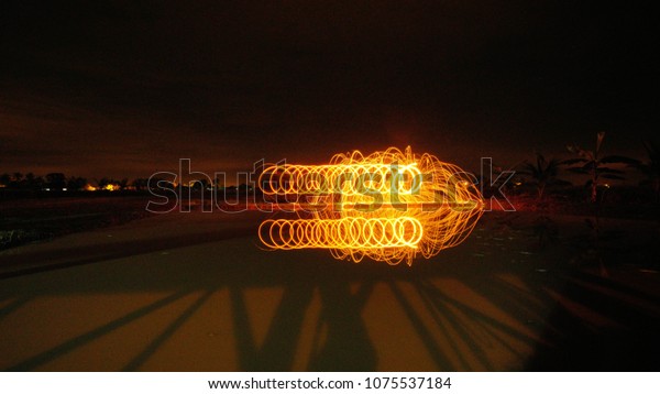 Light painting / light drawing with fire and\
steel wool underground