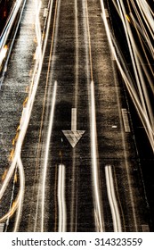 Light Painting On Asphalt Road By Vehicle Moving With Arrow Sign 