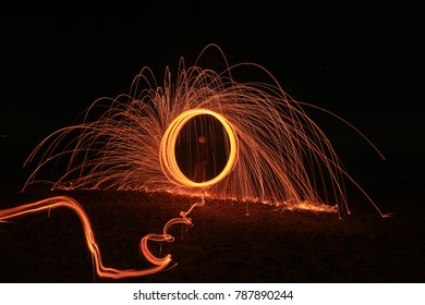 Light Painting With Steel Wool On A Beach In Kent.  Steel Wool Is Set Alight And Spun Around To Give Sparks Off And Create An Abstract Effect.