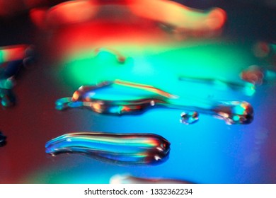 Light Pass Through Glass Surface With Droplets Causing Diffraction And Interference 
Effect. Concept Of Electro-magnetic Wave Energy, Spectrum.