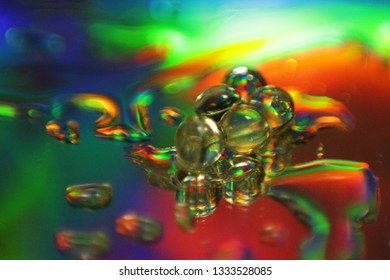 Light Pass Through Glass Surface With Droplets Causing Diffraction And Interference 
Effect. Concept Of Electro-magnetic Wave Energy, Spectrum.