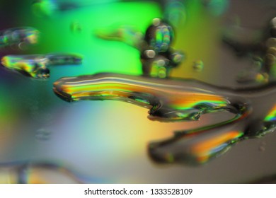 Light Pass Through Glass Surface With Droplets Causing Diffraction And Interference 
Effect. Concept Of Electro-magnetic Wave Energy, Spectrum.