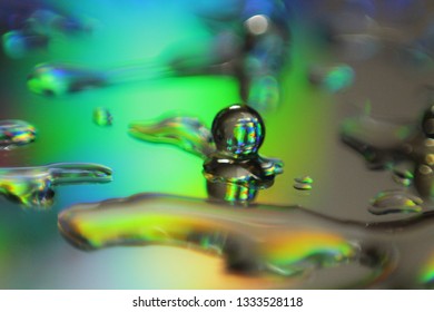 Light Pass Through Glass Surface With Droplets Causing Diffraction And Interference 
Effect. Concept Of Electro-magnetic Wave Energy, Spectrum.