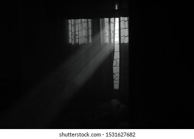
Light passing through window in dark room