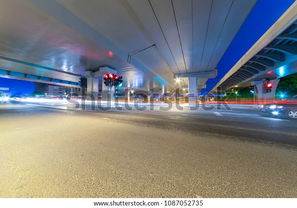 The
light path of a car under a highway and a
viaduct.