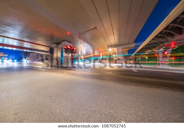 The
light path of a car under a highway and a
viaduct.