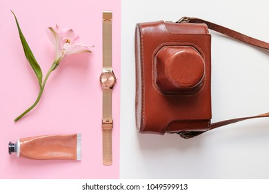 Light Pink Flat Lay Composition with Retro Camera in Case, Watch, A Tube of Cream, Gentle Flower Minimal Style Concept of Beauty Fashion Women Top View  Trendy Colorful - Shutterstock ID 1049599913