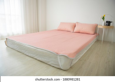 The Light Pink Pastel Pillows And Pink Bedsheet In The Comfort Bedroom