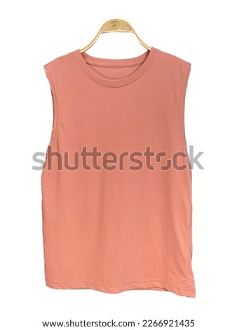 light pink plain sleeveless shirt isolated, mockup. Hanging light pink sleeveless shirt.