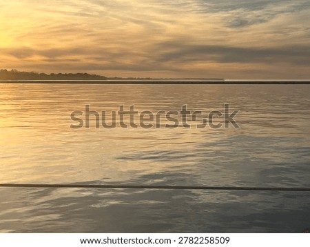 Light pink sunset with scratchy clouds 