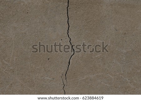 Light plastered wall with crack for background. Close up detail.