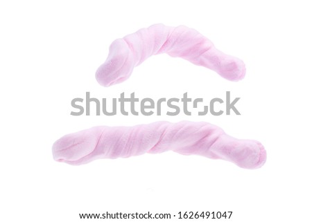Light plasticine of pink color in different shapes and positions isolated on white background